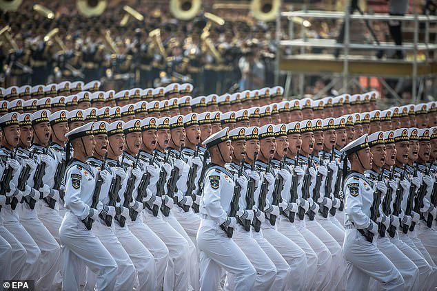 The Chinese 'Hypersonic Glide Vehicles' fly on lower trajectory than intercontinental ballistic missiles, making them harder to intercept. Picture shows Chinese navy troops marching past Tiananmen Square during a military parade