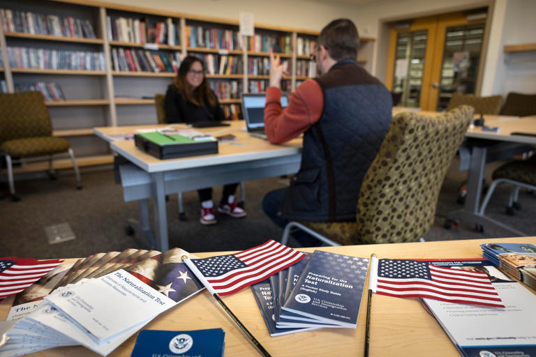 A Citizenship and Immigration Services officer instructs an immigrant ahead of her naturalization exam, on August 9, 2023, in Alaska.