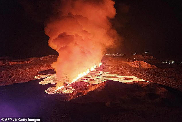 Incredible moment Icelandic volcano erupts along two-mile long fissure ...