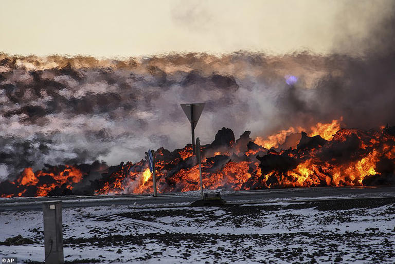 Tourists are evacuated as lava SWALLOWS road surrounding one of Iceland ...