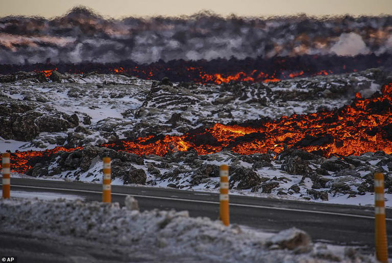 Tourists are evacuated as lava SWALLOWS road surrounding one of Iceland ...