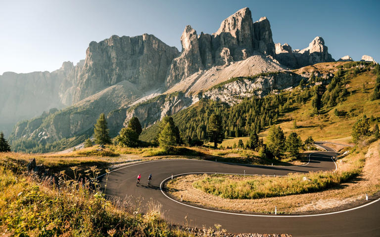 Cyclists explore the spectacular scenery of the Dolomites in Italy - Alex Moling