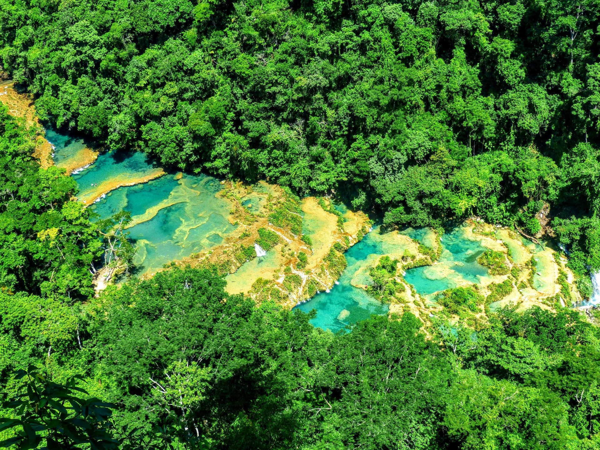 The stepped, natural pools embedded within this natural monument known as Semuc Champey, which means "where the river hides under the stones," sparkle in glorious turquoise. No wonder it's a desired (albeit remote) <a href="https://uk.starsinsider.com/travel/302159/amazing-secluded-swimming-spots-around-the-world">swimming</a> destination.