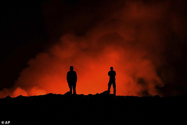 Incredible moment Icelandic volcano erupts along two-mile long fissure ...