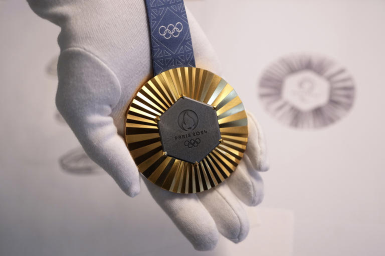 Medals for Paris 2024 Olympics embedded with pieces of Eiffel Tower