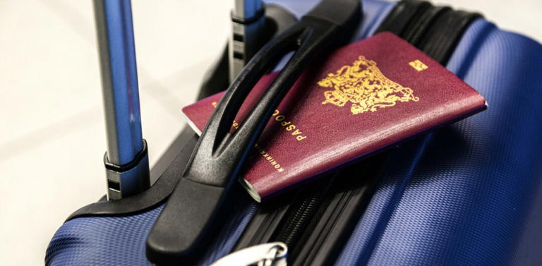 Travel essentials for 2024 - suitcase with passport