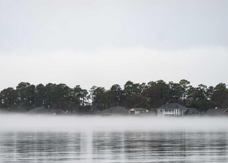 Fog is seen along homes on Lake Conroe, Wednesday, Jan. 24, 2024, in Conroe.