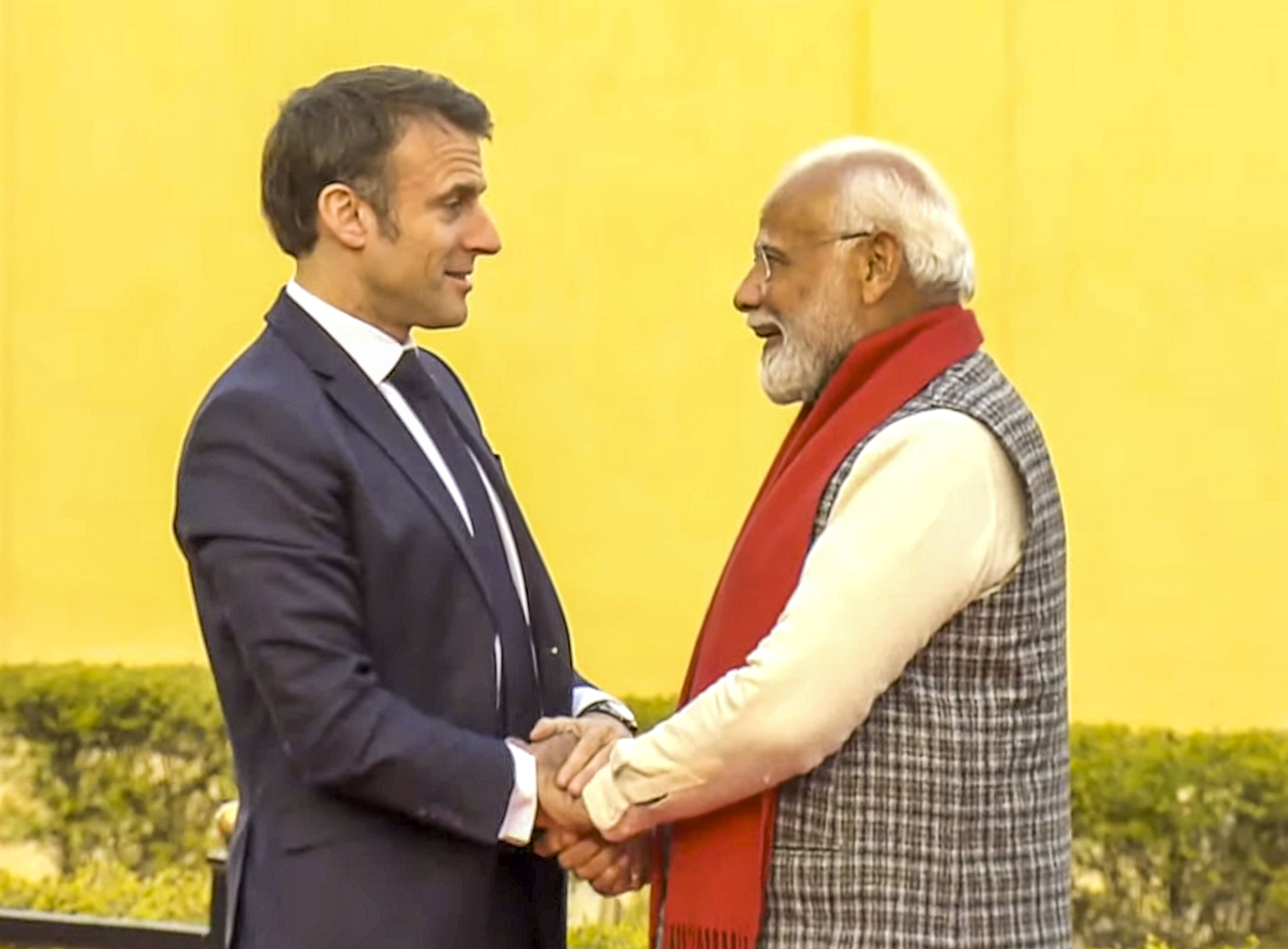 when macron met modi: french leader joins pm in roadshow, gets ram temple replica as gift
