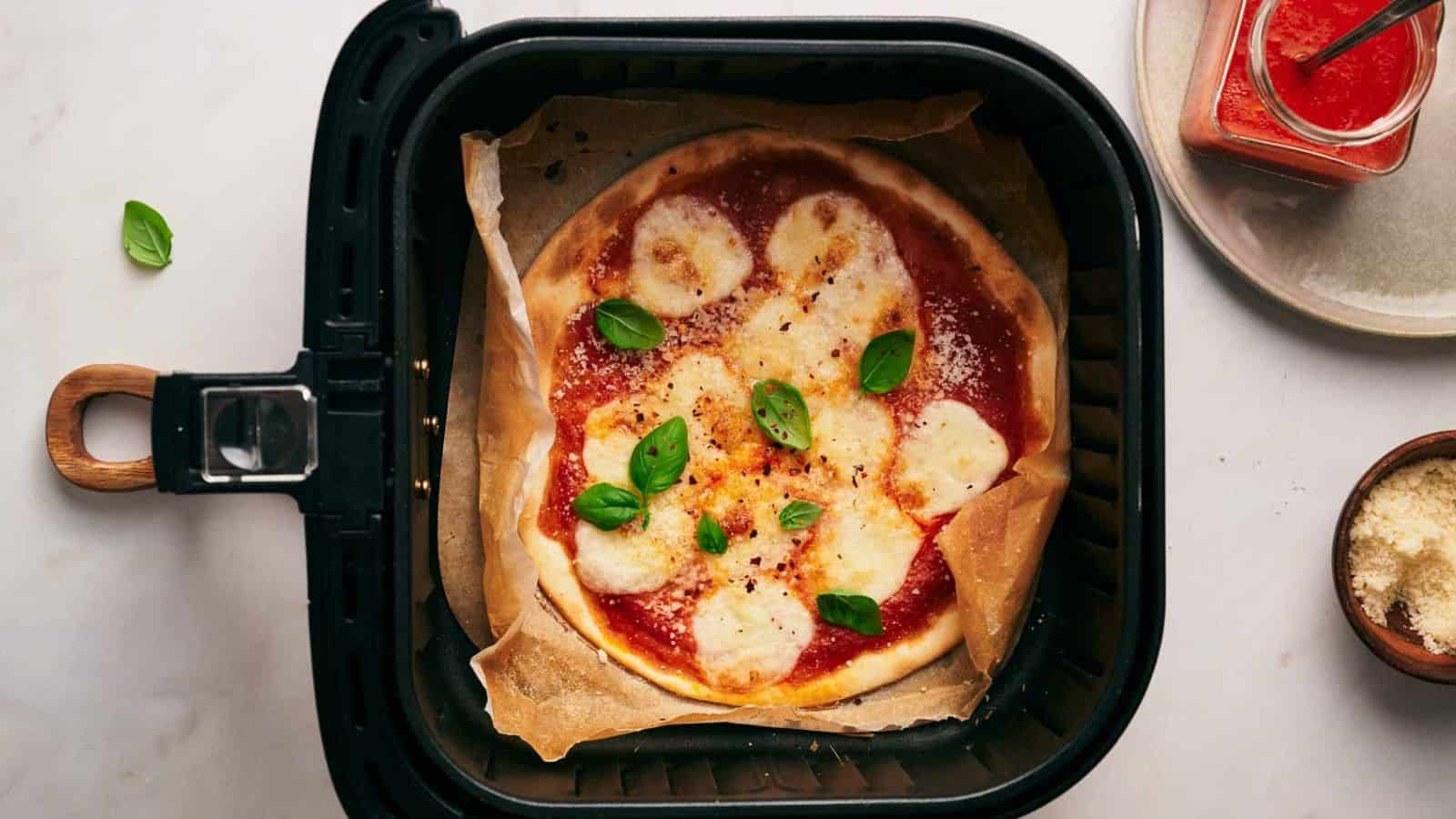 <p>Craving pizza? Our Air Fryer Pizza is your quick fix. Skip the delivery wait and enjoy a crispy crust and perfectly melted cheese right at home. With minimal effort, you’ll have a tasty pizza that rivals your favorite pizzeria, all thanks to the magic of the air fryer.<br><strong>Get the Recipe: </strong><a href="https://www.splashoftaste.com/air-fryer-pizza/?utm_source=msn&utm_medium=page&utm_campaign=msn">Air Fryer Pizza</a></p>