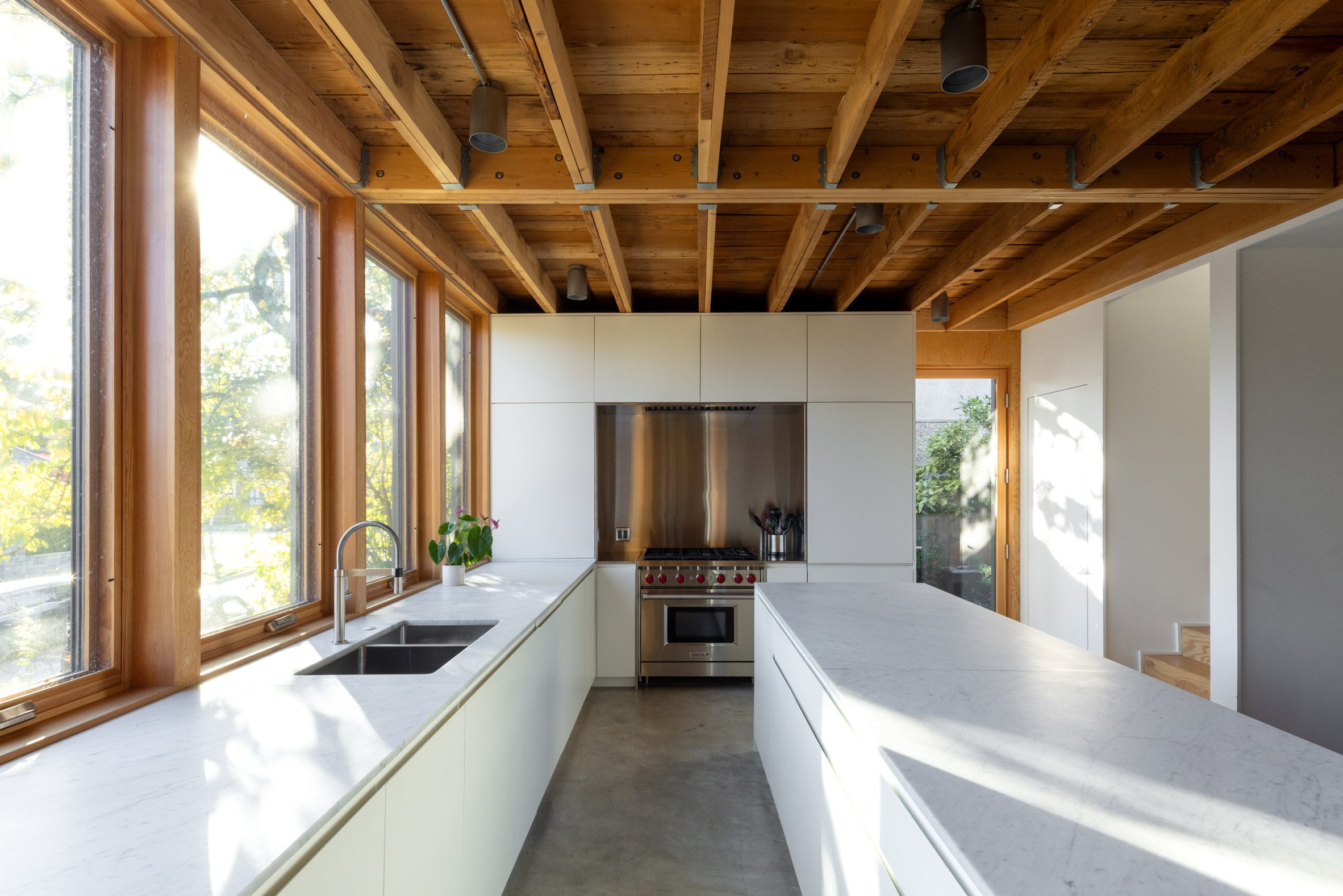 d’arcy jones adds subterranean garage to century-old house in vancouver