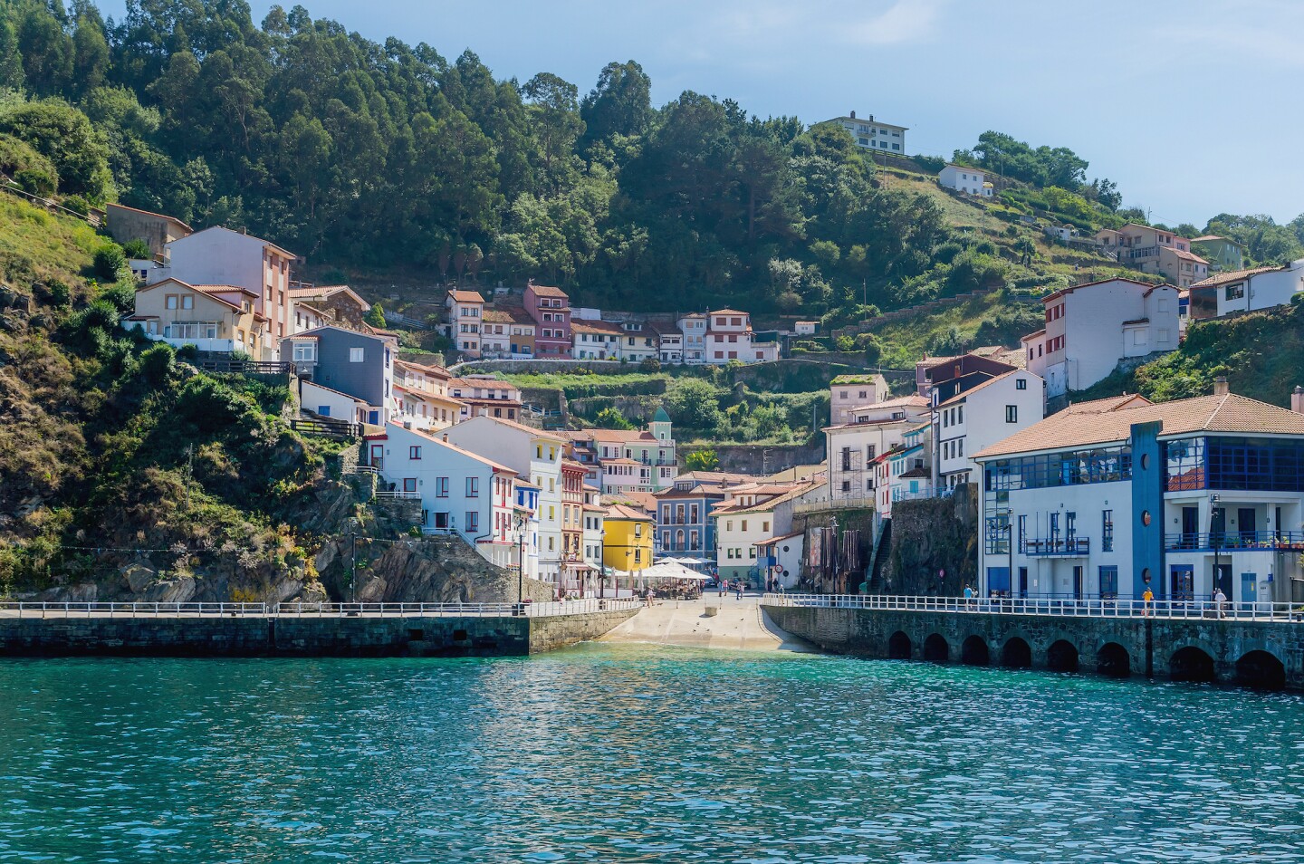 <h2>8. Cudillero</h2> <p><i>Asturias</i></p> <p>Many of Spain’s big cities attract tourists from around the world, so much so that its <a class="Link" href="https://www.afar.com/magazine/the-most-beautiful-villages-in-spain" rel="noopener">beautiful small villages</a> can be overlooked. Cudillero is one of the nearly 20,000 pueblos found throughout Spain, and a lovely one at that: Located by the Bay of Biscay, this fishing village of around 5,000 people is a masterclass of slow living by the sea. Colorful, orange-roofed houses dot the hillsides, which also serve as vantage points for panoramas of both town and ocean.</p>