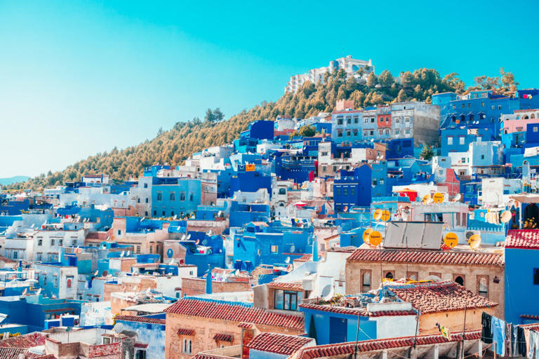 Morocco is an underrated destination with plenty to see and do. Learn more about its best features and some of its safety threats for travelers. pictured: the popular blue buildings of Morocco