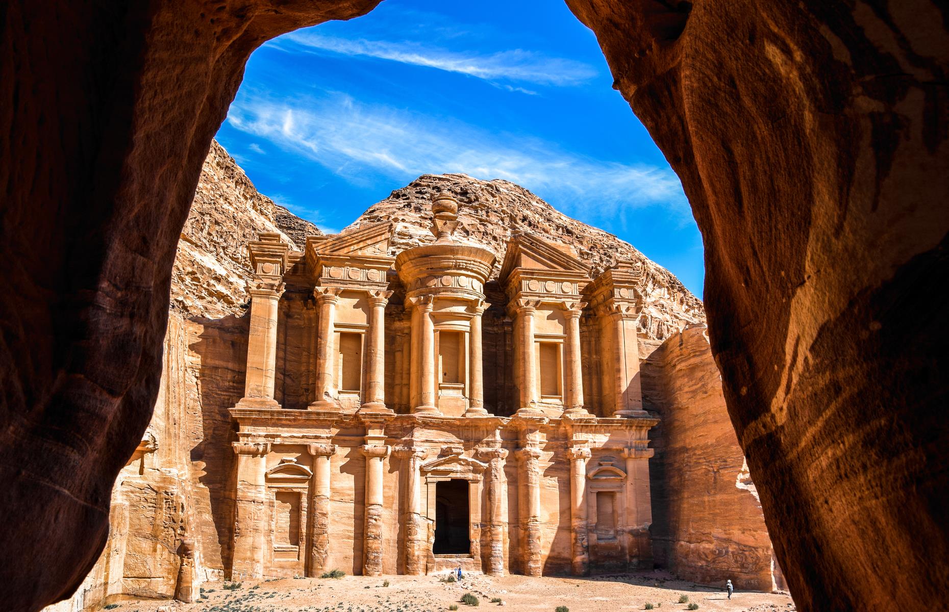 <p>The desert kingdom of Petra is Jordan’s prize treasure and a wonder of the world. Carved into a sheer rock face more than 2,000 years ago by the Nabataeans (a nomadic tribe who eventually settled), it became the capital of their wealthy trade empire with the east and west. The Siq, Treasury, the Colonnaded Street, the High Place of Sacrifice, the Royal Tombs and the Roman theater are a few highlights of the vast site. When the Nabataean civilization declined it was taken over by the Romans.</p>