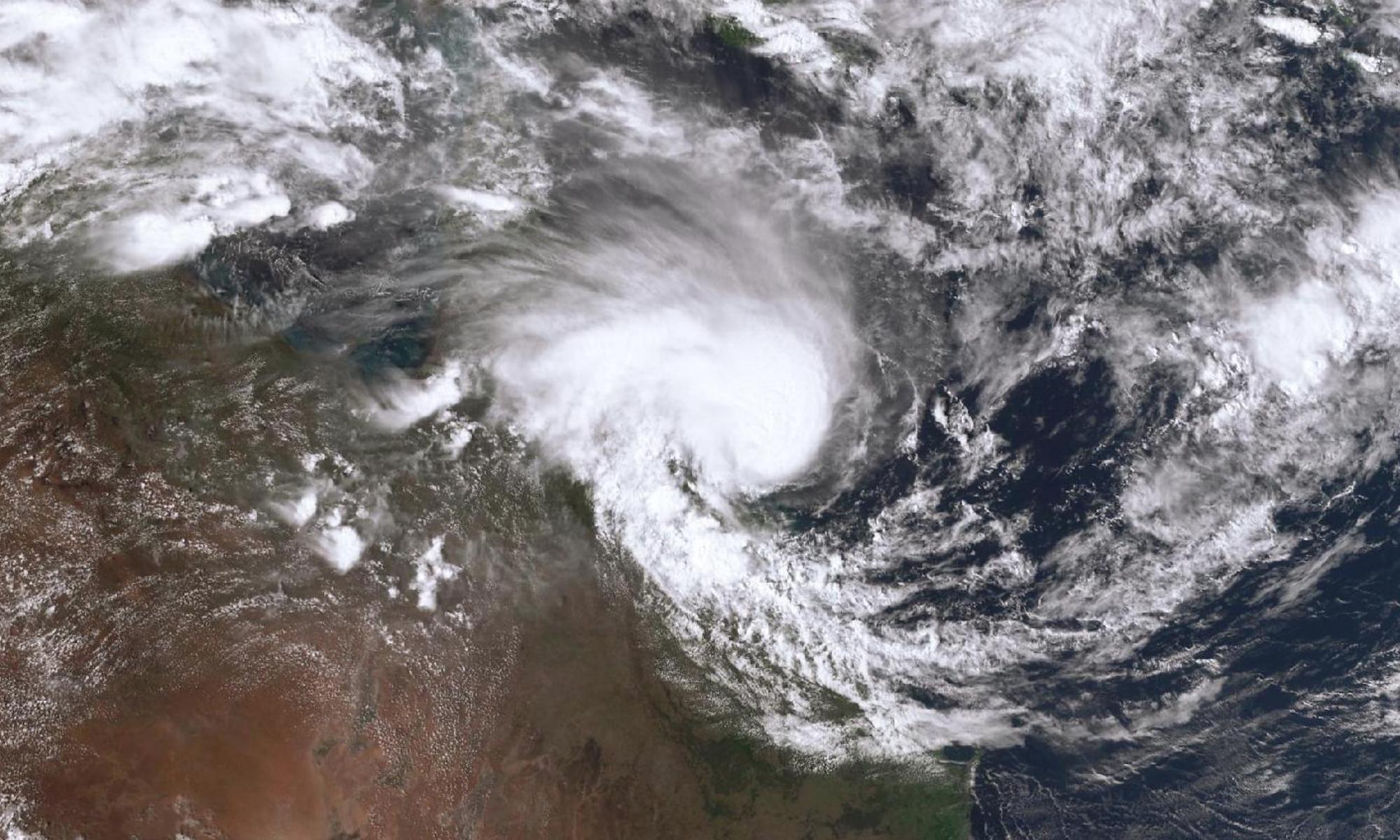 ‘like a ghost howling’: tropical cyclone kirrily to bring heavy rain to queensland as townsville residents survey damage