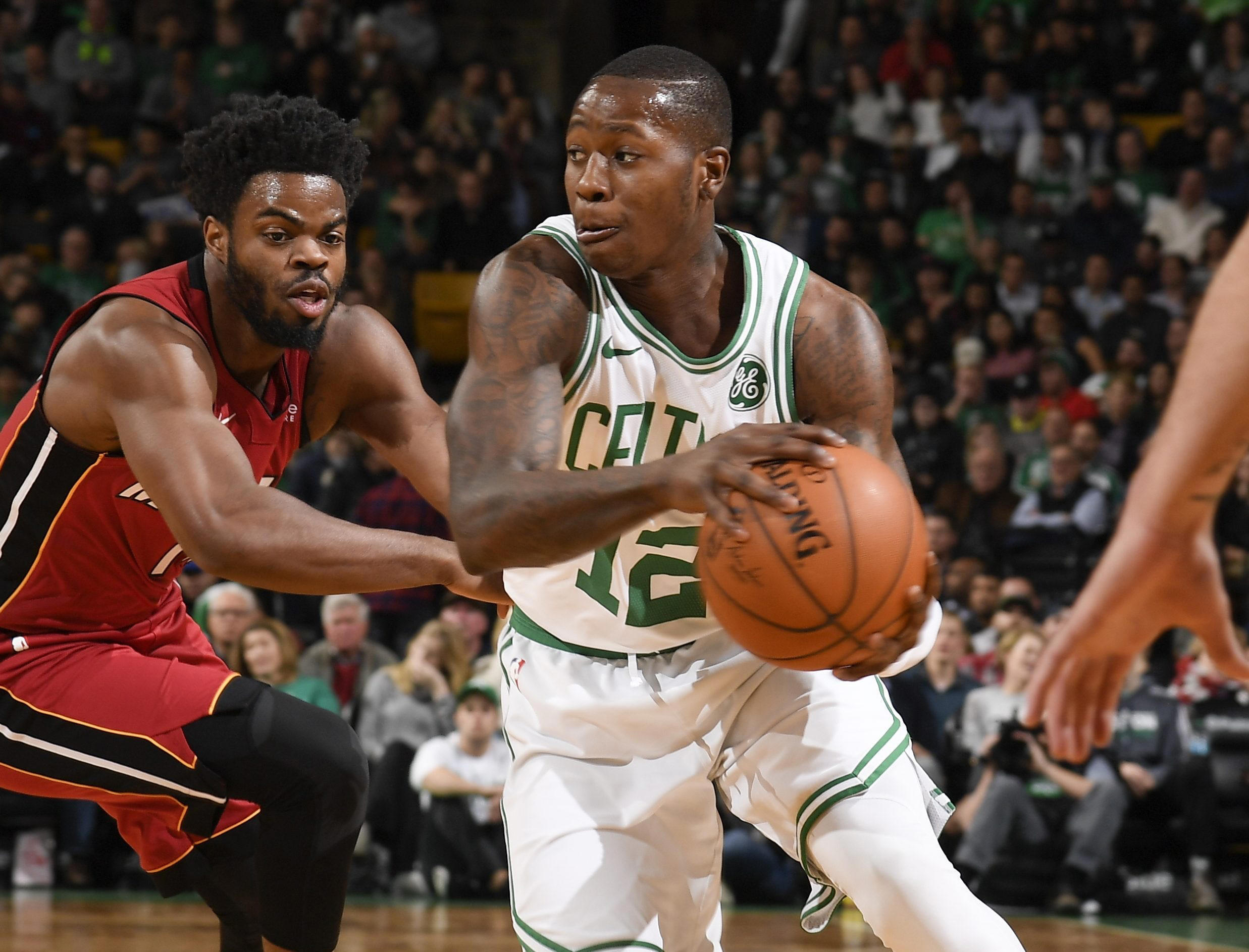 The Boston Celtics defeat the Miami Heat 110-106 in classic rivalry matchup