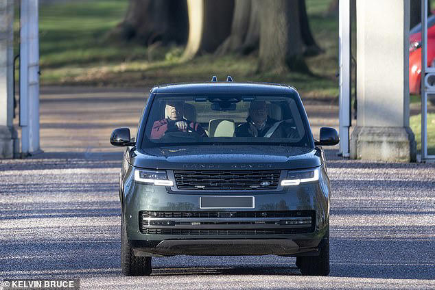 Prince Andrew is spotted driving through Windsor Park with an aide