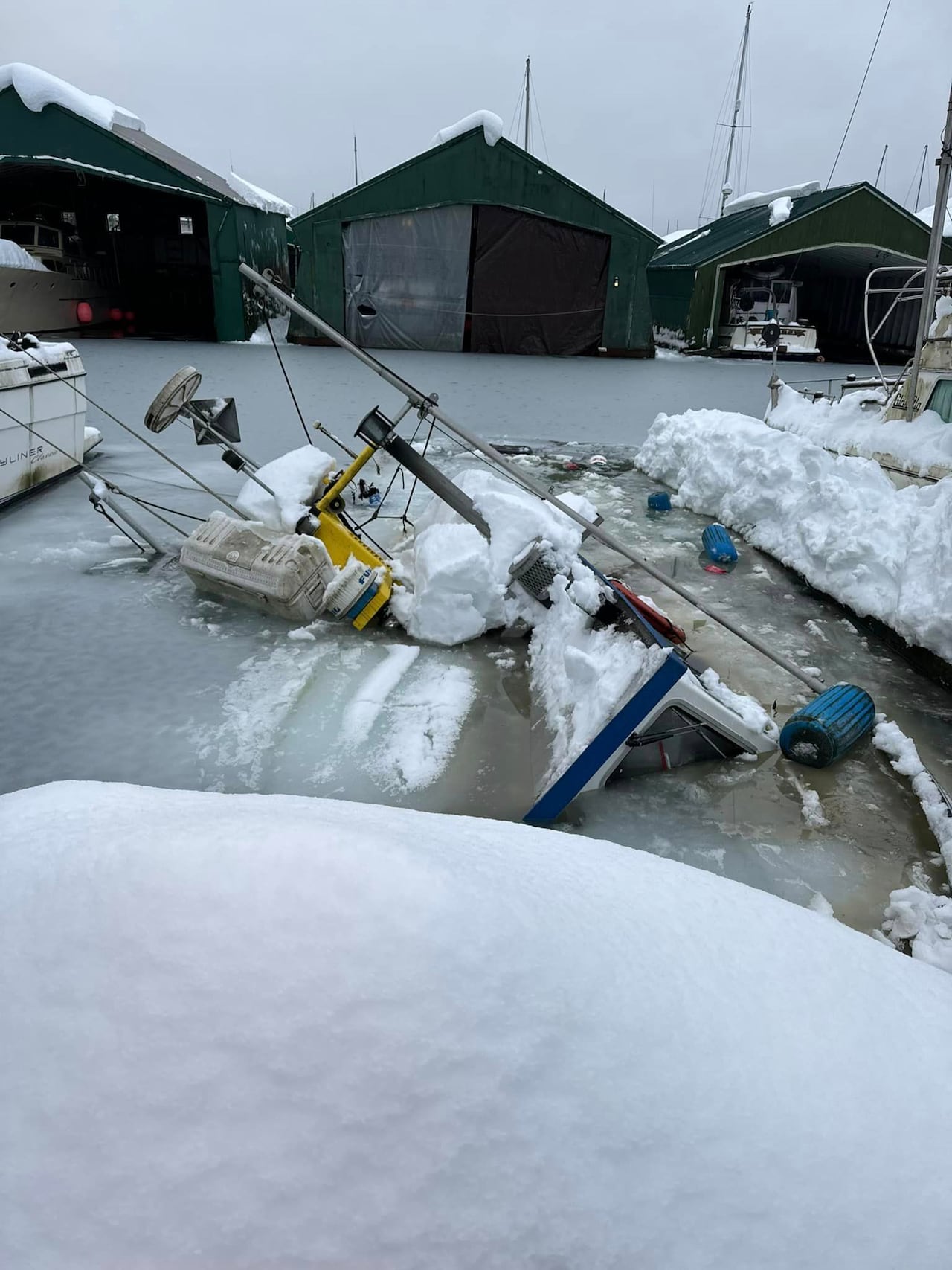 heavy snowfall in juneau, alaska, sinks boats in harbour