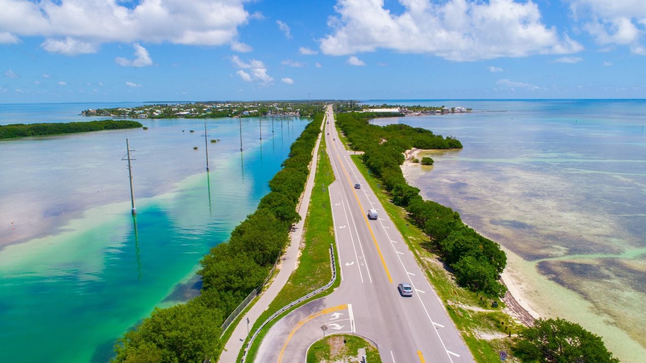 <p>The beautiful Overseas Highway stretches just over 100 miles across the Florida Keys, and the views are as breathtaking as possible. As you cross the Old Seven Mile Bridge, you can see the crystal clear ocean waters straight through to the sand and coral below. </p>