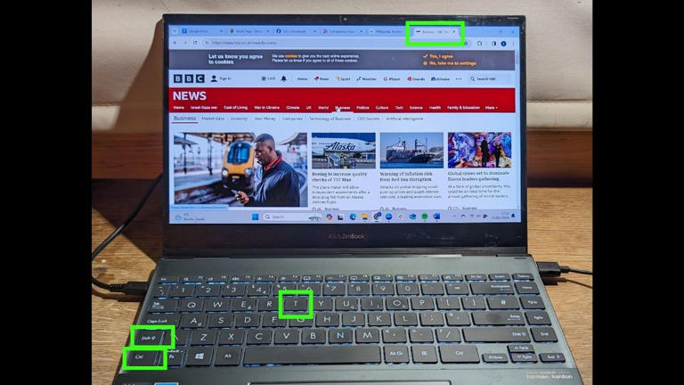  How to switch tabs in a web browser - Photo of a laptop with keys and browser tab highlighted