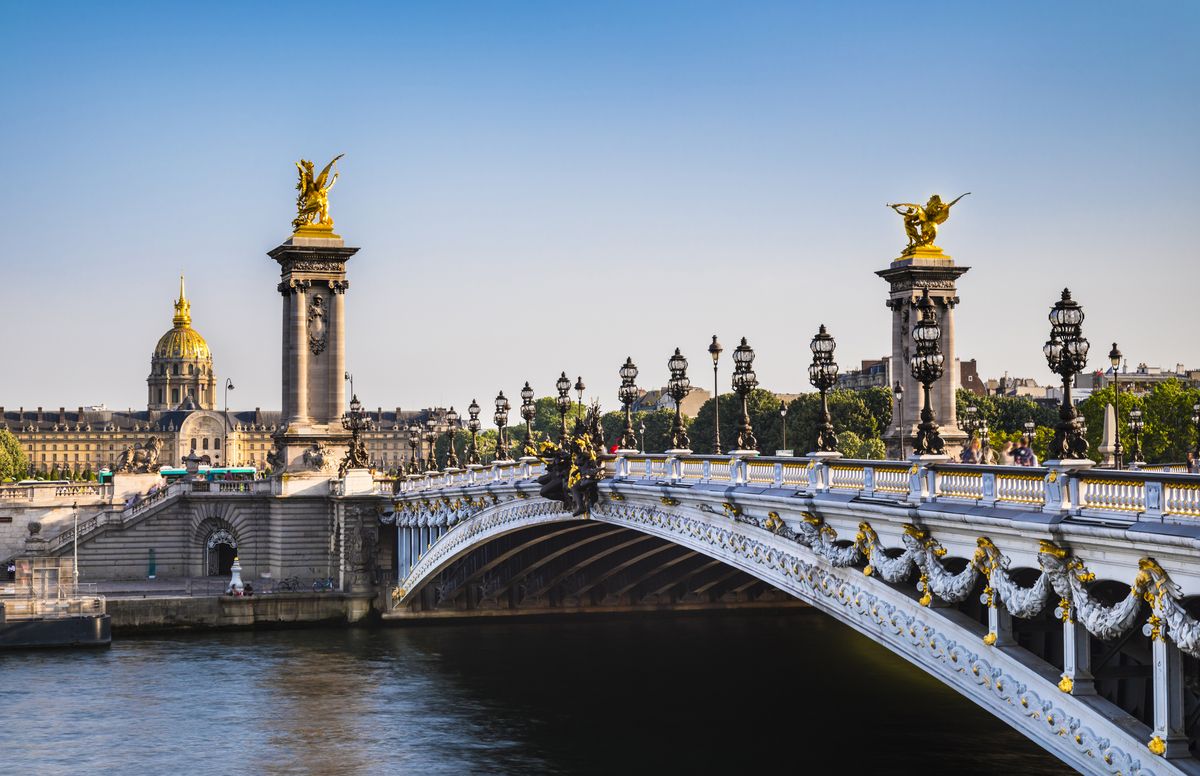 <p>Ornate and extravagant, the Pont Alexandre bridge is named for the tsar who sealed the Franco-Russian Alliance in 1894. Cherubs, winged horses, and golden nymphs adorn the structure that stretches over the Seine, connecting the Champs-Élysées shopping district and Grand Palais on the right bank with the neighborhood surrounding the Eiffel Tower on the left bank.</p>