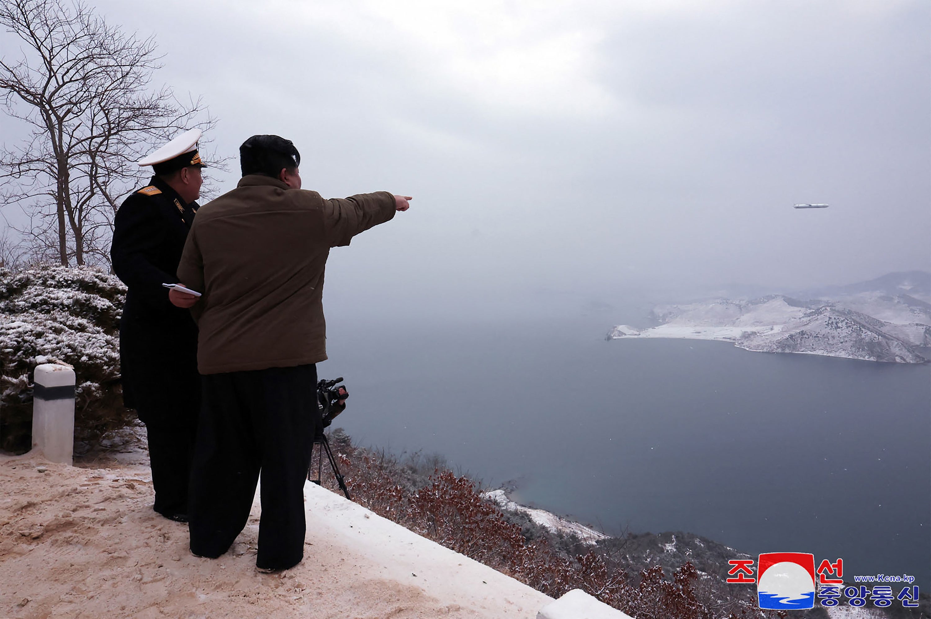 kim jong-un test-fires north korean nuclear-capable cruise missiles from submarine, says state media