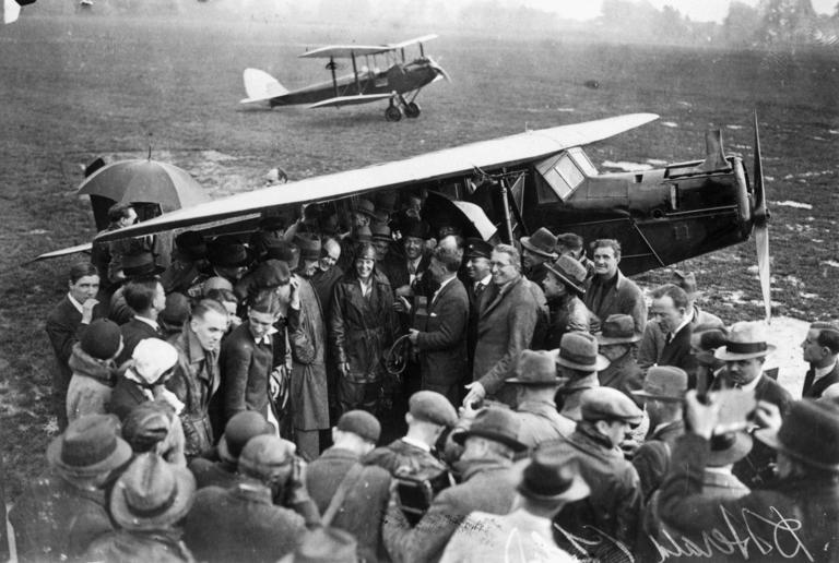 Amelia Earhart is surrounded by a crowd of wellwishers and reporters after crossing the Atlantic in 1932 (Getty)
