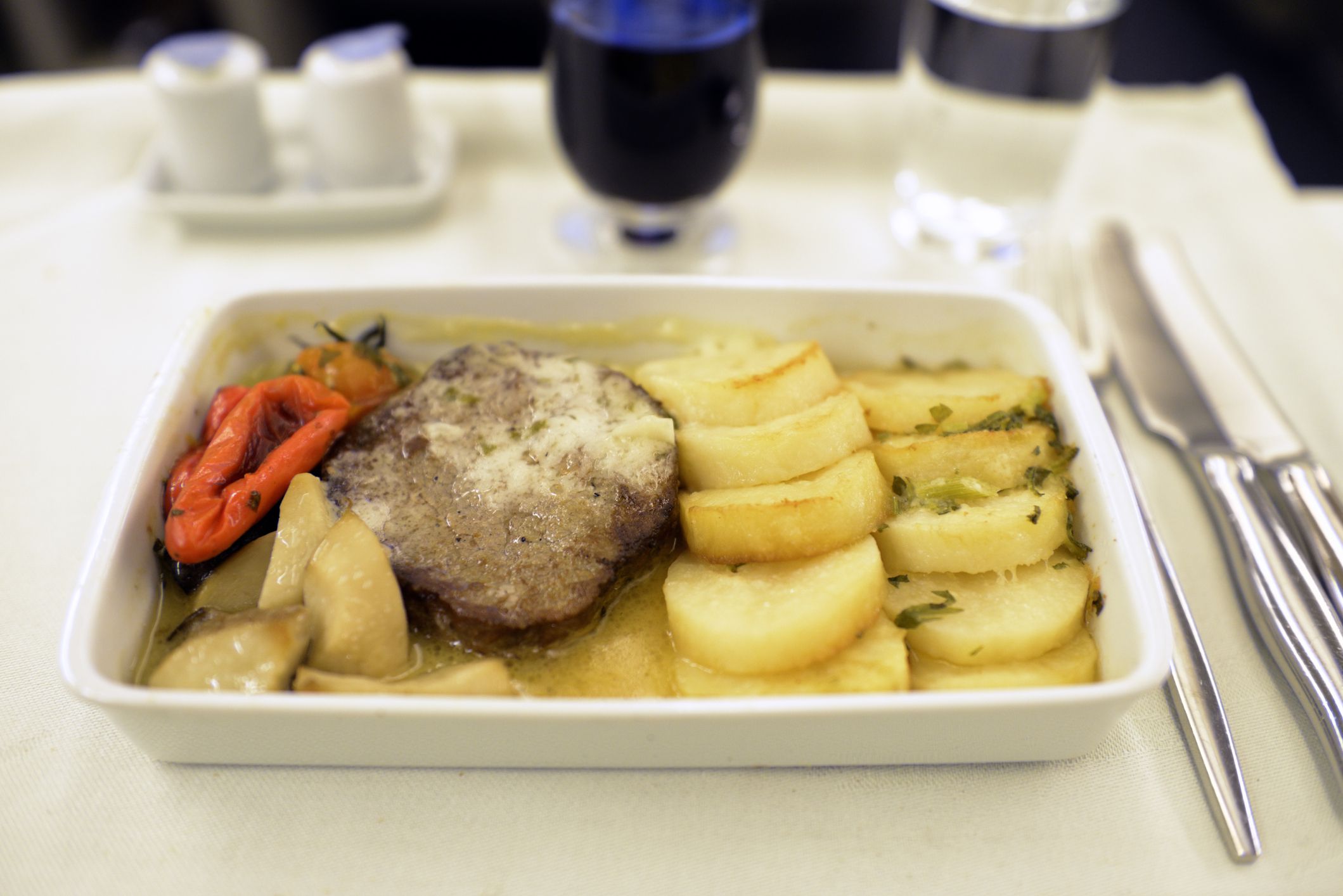 <p>If you have the option of steak for your in-flight meal, it's better to choose something else. Steak will almost always be overcooked because it has to be pre-cooked and reheated on the plane. So unless you love tough, chewy, gray beef, go for chicken or pasta. </p><p><b>Related:</b> <a href="https://blog.cheapism.com/things-to-never-do-on-airplane/">Things You Should Never, Ever Do on a Plane</a></p>