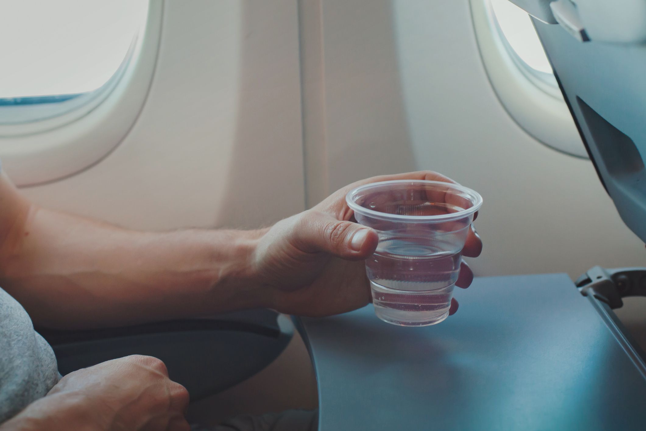 <p>According to flight attendants, you <a href="https://time.com/4978498/airline-drinking-water-bacteria/">shouldn't drink tap water on an airplane</a>. The tanks that hold the water are rarely cleaned, and many of the flight attendants won't drink the water themselves. That's good enough reason for us to bring a bottle of water on board.</p>