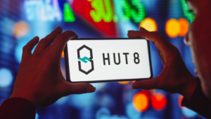 In this photo illustration the Hut 8 Mining logo seen displayed on a smartphone screen