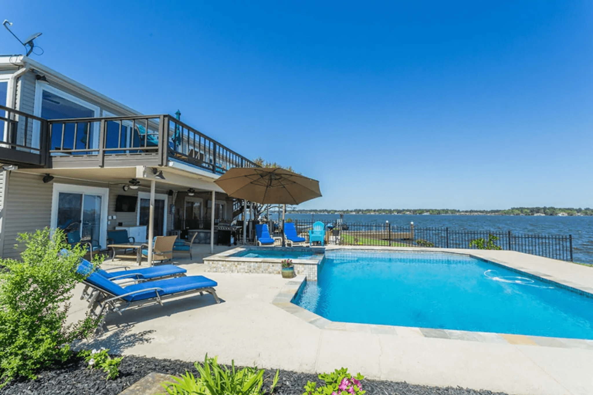 <p class="listicle-page__cta-button-shop"><a class="shop-btn" href="https://www.vrbo.com/1059632?">Book Now</a></p> <p>One of the most popular swimming destinations in Texas, Lake Travis is a magnet for anyone daydreaming about floating on crystal-clear waters under bluebird skies. The lake is fed by two springs and is framed by an abundance of cypress and oak trees, and this gorgeous waterfront ranch is the ideal setting to enjoy the quiet lake life. There are several walking trails around the property, a fire pit by the water, and a cliff for launching yourself into the lake on a hot Texas summer day.</p>