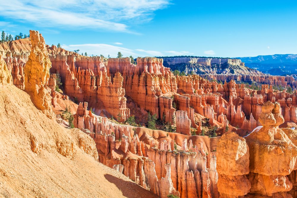 <p>Bryce is unlike any canyon of its kind with hundreds of uniquely shaped "hoodoos" lining its floor. Enjoy these red rock formations, which the Paiute Indians thought to be men who had been turned to stone, from the Rim Trail above or hike into the canyon itself through dense bristlecone pine trees (the oldest trees in the world!) and a rainbow of orange-pink hues.</p>
