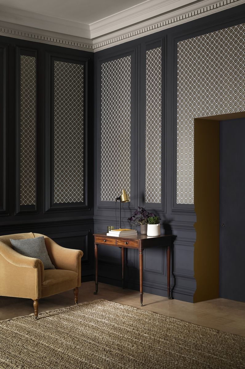 <p>Create interest with wallpaper panels. This all over lattice design works perfectly against the dark grey; it's a subtle pattern and not too big but it stands out. The design is reminiscent of tiles and has a touch of Morocco about it.</p><p><em>Top Tip:</em> This living room wallpaper idea works particularly well tall ceilings.</p><p><em>Pictured: Quatrefoil Kohl wallpaper, <a href="https://www.paintandpaperlibrary.com/quatrefoil-kohl">Paper Library</a></em></p>