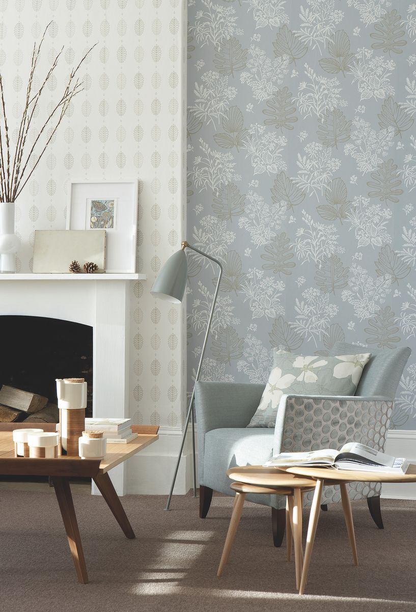 <p>For an interesting living room wallpaper idea, choose your colour palette then use different patterned wallpapers in different areas. Choose one for the walls and a different one for the chimney breast. It will define the areas in a complementary way. Then follow the theme on the <a href="https://www.housebeautiful.com/uk/decorate/g32597929/best-velvet-armchair/">armchair</a> with different fabrics on the body of the chair and the sides.</p><p><em>Pictured: Alcove walls: Norcombe in Welkin; Chimney Breast: Cones in Lint; Skirting and fireplace painted in Shirting no. 129, all <a href="https://www.littlegreene.com/">Little Greene</a></em></p>