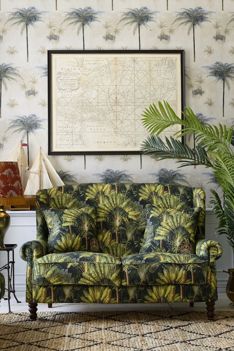 <p>Bring relaxed holiday vibes to your living room with a wallpaper design which reflects soft tones and tropical elements, like this Caribbean-inspired large scale painted palm tree wallpaper. Here, dark contours of the palm stems blend with pastel greens and sandy shades of gold, in a hazy, calming composition.</p><p><em>Pictured: CAYO LARGO Wallpaper, <a href="https://mindtheg.com/uk/products/stories/the-tropical-cottage/cayo-largo.html">MINDTHEGAP</a></em></p>