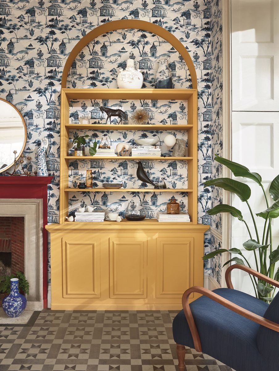 <p>Make a feature of bespoke furniture in your living room by using patterned wallpaper to accentuate its design and features. This charming wallpaper print wonderfully adds so much extra detail, giving the bookcase within the arched alcove an extra dimension beyond its artfully styled shelves.</p><p><em>Pictured: Shop the Heritage Revival trend at <a href="https://www.johnlewis.com/search?search-term=heritage+revival">John Lewis & Partners</a></em></p>