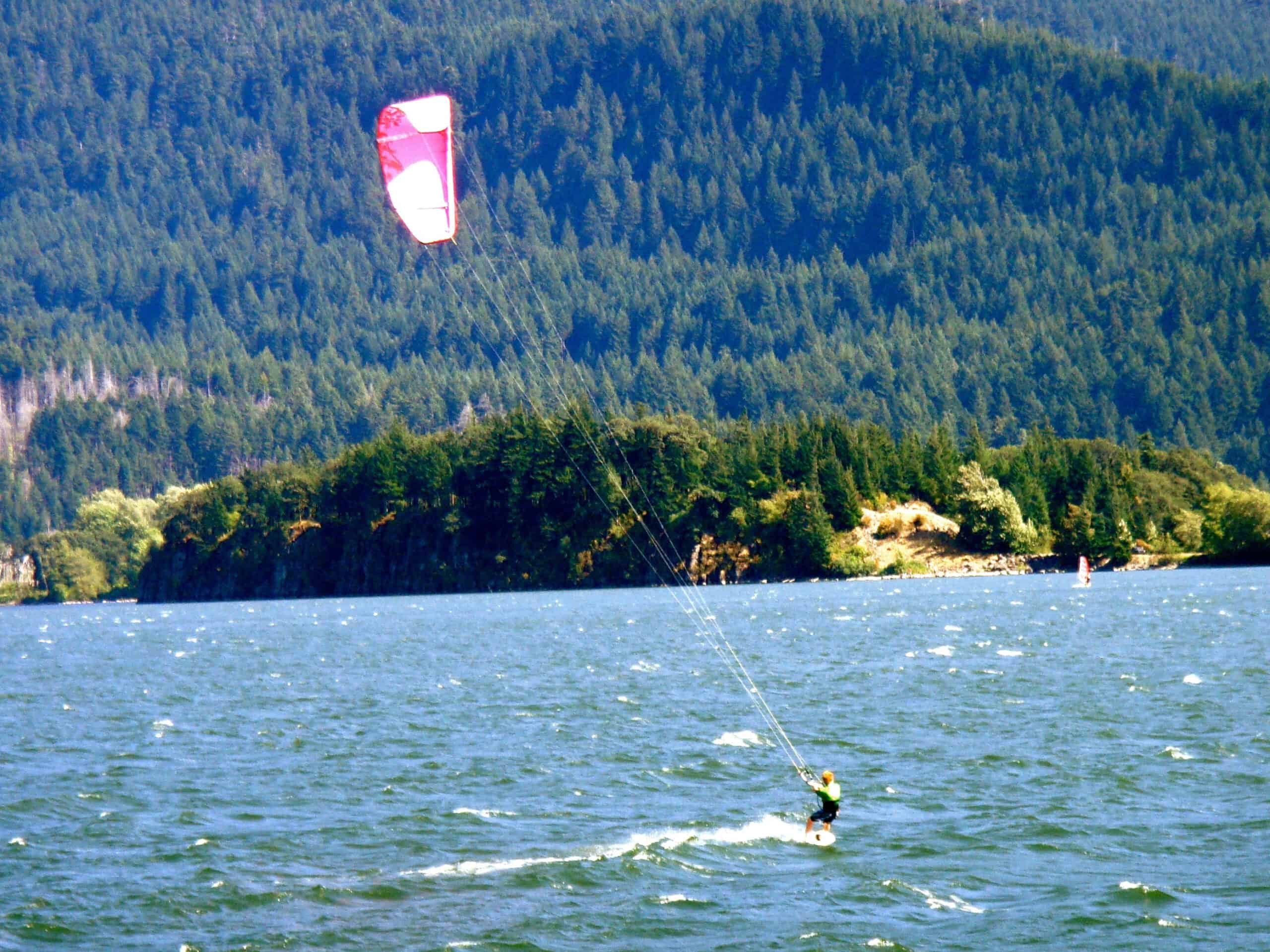 <p>Hood River, Oregon, is a small town on the Columbia River. The town is most famous for being the “Windsurfer capital of the World.” It’s a unique spot in the always-windy Columbia River Gorge and makes for excellent windsurfing. But that is not the only water sport that locals enjoy; there is wind foiling, kayaking, and more in this area. It is close to Portland, just one one-hour drive, and the surrounding mountains have excellent hiking trails. Plus, the culinary scene here is quite impressive for such a small town. And there are several breweries, so if windsurfing isn’t your thing, you can enjoy a beer and watch the water. Hood River makes a great day trip, and it’s worth the time to come and explore.</p>