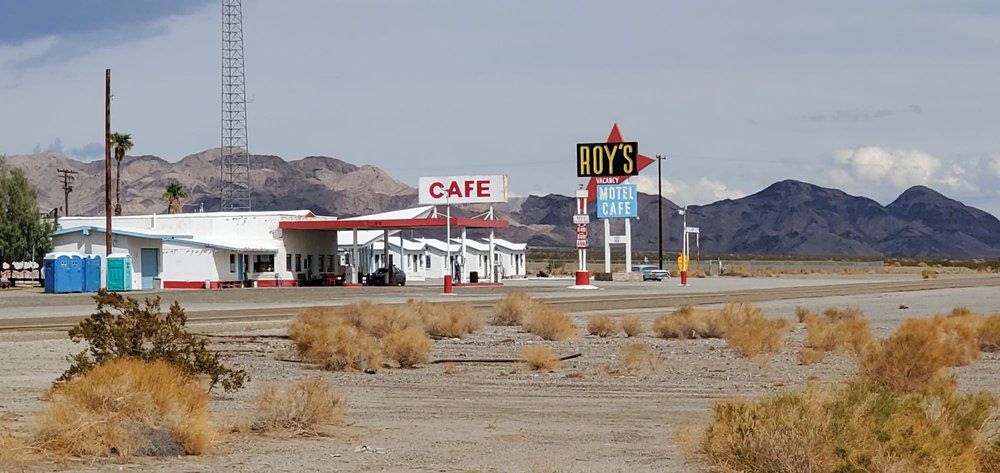 <p><b>Amboy, California</b></p><p><a href="https://visitamboy.com">Roy's</a> started as a gas and service station in 1938, an oasis on Route 66 in the Mojave Desert. It soon grew to include a cafe and cabins for overnight rentals, and supported a small community of 700 people in the town. At its peak in the 1950s, it was operating 24 hours a day, but eventually fell into disrepair after Interstate 40 was built in 1972. The entire town — all 950 acres — was sold for $425,000 in 2005, and many buildings have been restored, including the iconic 1959 arrowhead neon sign that's the main attraction. Potable water is a problem here, so the cafe isn't operating, but you can still see the diner's counter, stools, and plenty of history inside.  </p>