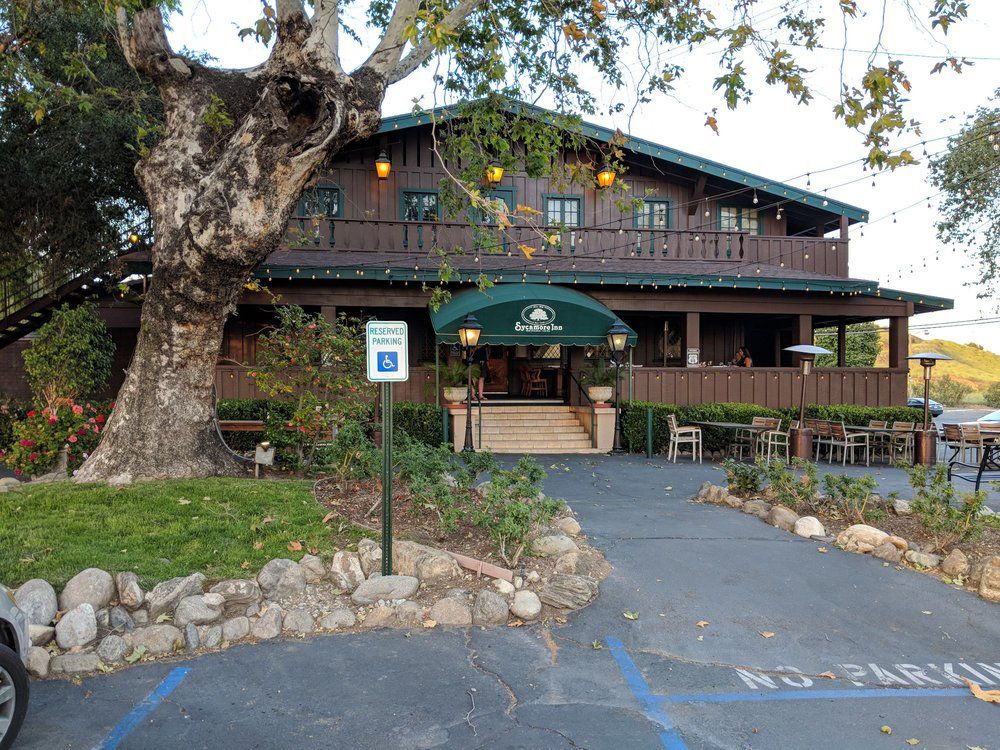 <p><b>Rancho Cucamonga, California</b></p><p>The restaurant now known as the <a href="https://www.thesycamoreinn.com">Sycamore Inn</a> has an incredibly long history, dating all the way back to the mid-1800s when an inn and tavern was built by "Uncle" Billy Rubottom on the Santa Fe Trail, which eventually became Route 66. The building that currently stands, along with its name, dates to 1920, and it's been a popular stop for travelers as well as celebrities since. It's an upscale spot that serves steak, oysters, and a large wine list in its chalet-style two-story wooden building. </p>