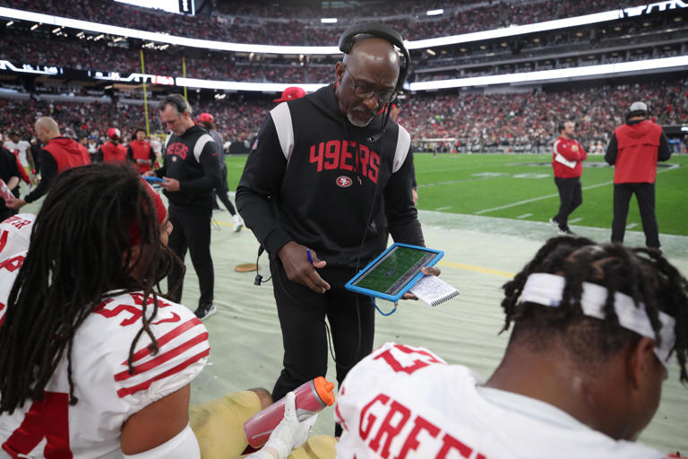 San Francisco 49ers linebackers coach Johnny Holland on the sideline during a game against the Las Vegas Raiders at Allegiant Stadium on Jan. 1, 2023, in Las Vegas, Nevada.  / Credit: Michael Zagaris / Getty Images