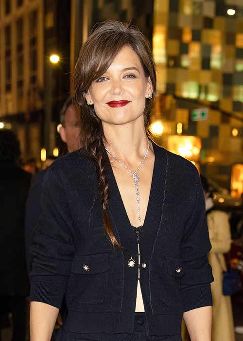 katie holmes rocks grey roots with a messy side-swept braid for a chanel event in nyc