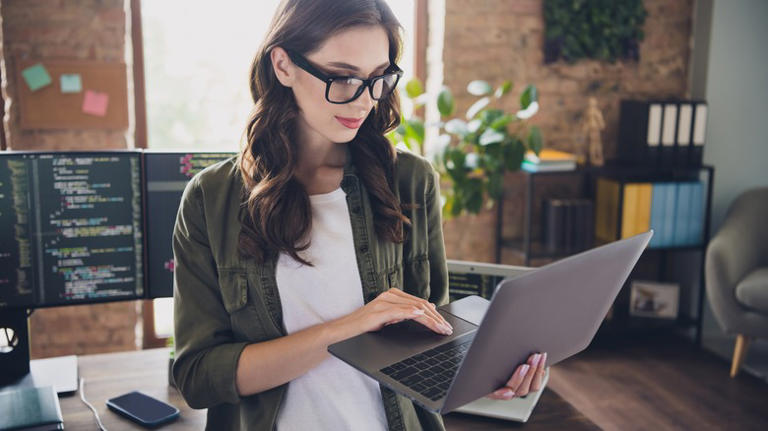 person holding MacBook