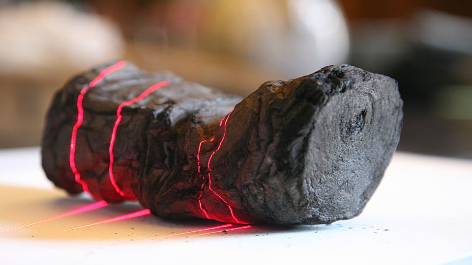 a philosopher’s words emerge from charred, ancient scrolls