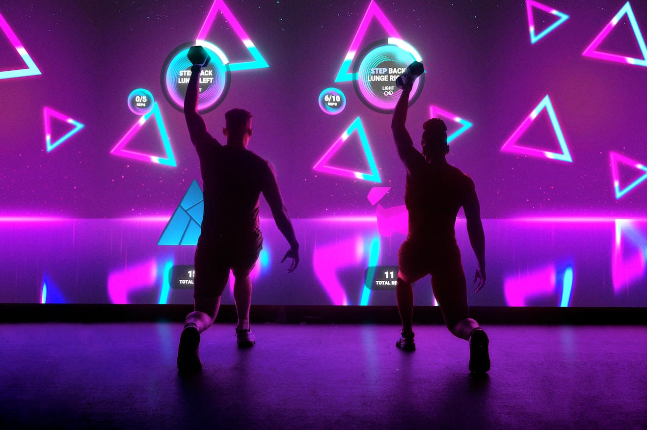 See inside the AI-powered fitness studio that's led by virtual trainers