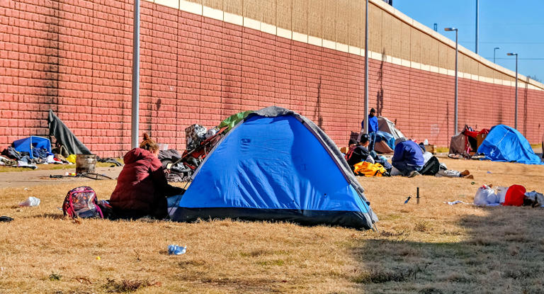 Homeless tents are set up along a retaining wall in Oklahoma City on Monday, Dec. 11, 2023.