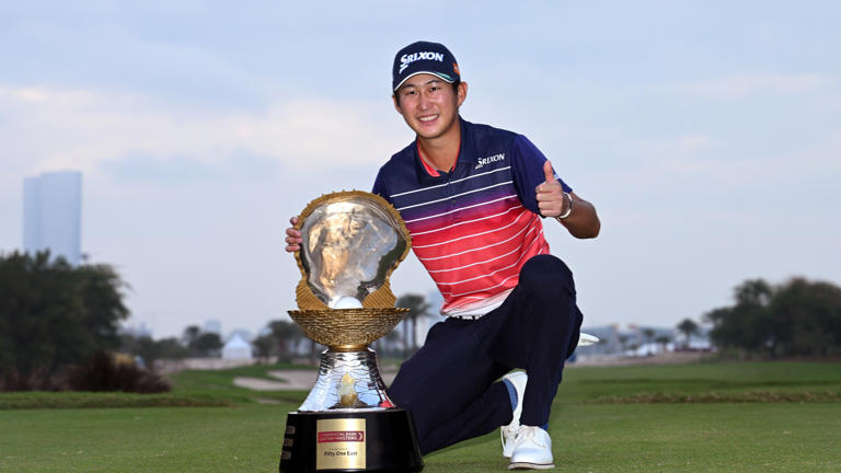 DOHA, QATAR - FEBRUARY 11: Rikuya Hoshino of Japan celebrates victory with the trophy during day four of the Commercial Bank Qatar Masters at Doha Golf Club on February 11, 2024 in Doha, Qatar. (Photo by Octavio Passos/Getty Images)
