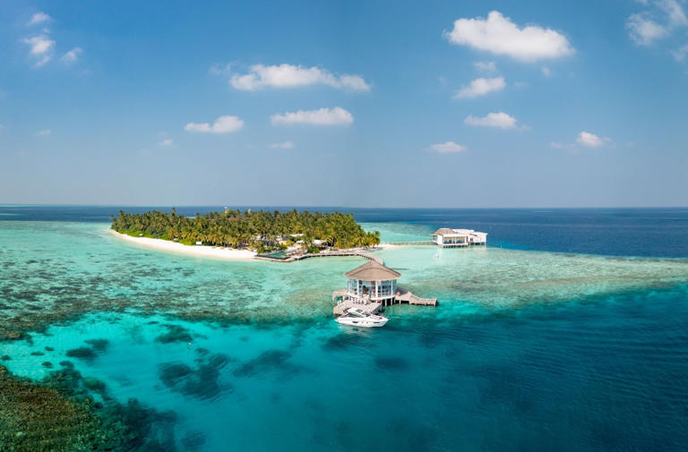 As my seaplane dips below the clouds, I catch my first glimpse of Raffles Maldives Meradhoo – a precious jewel cast upon