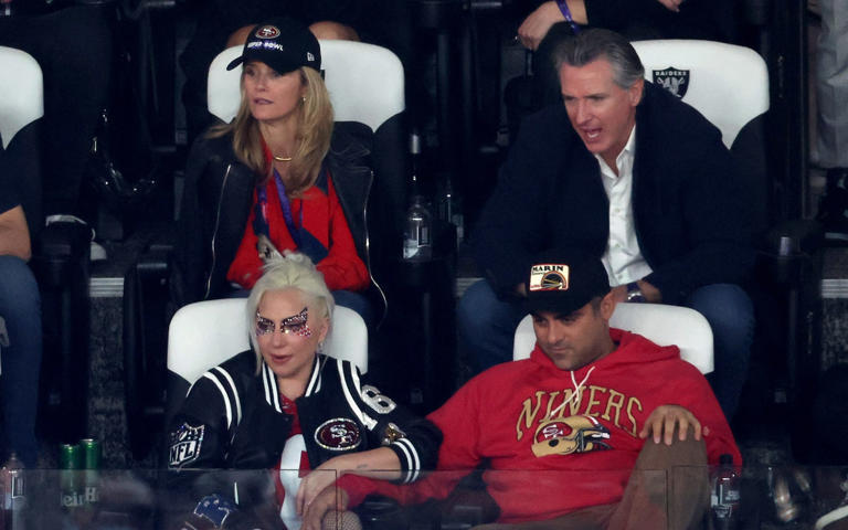 Jennifer Siebel Newsom and Gavin Newsom, the California governor (top L-R) and Lady Gaga with boyfriend Michael Polansky (bottom L-R) look on during Super Bowl LVIII - ROB CARR/GETTY IMAGES