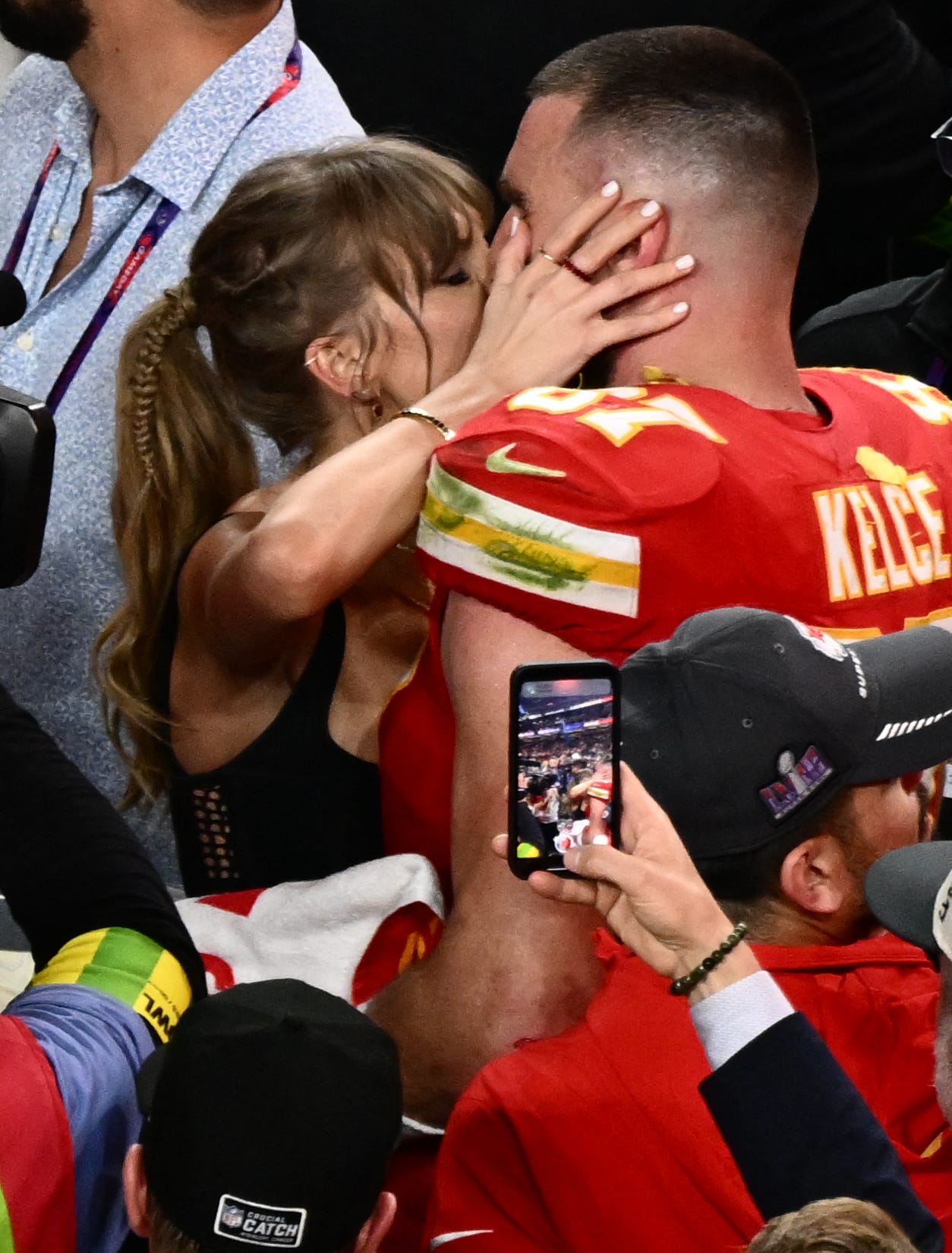 Taylor Swift gives Travis Kelce celebratory kisses after Super Bowl LVIII win: See the photos