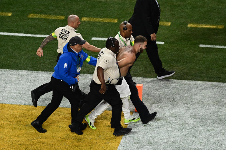 Two half-naked streakers get rocked by Super Bowl security