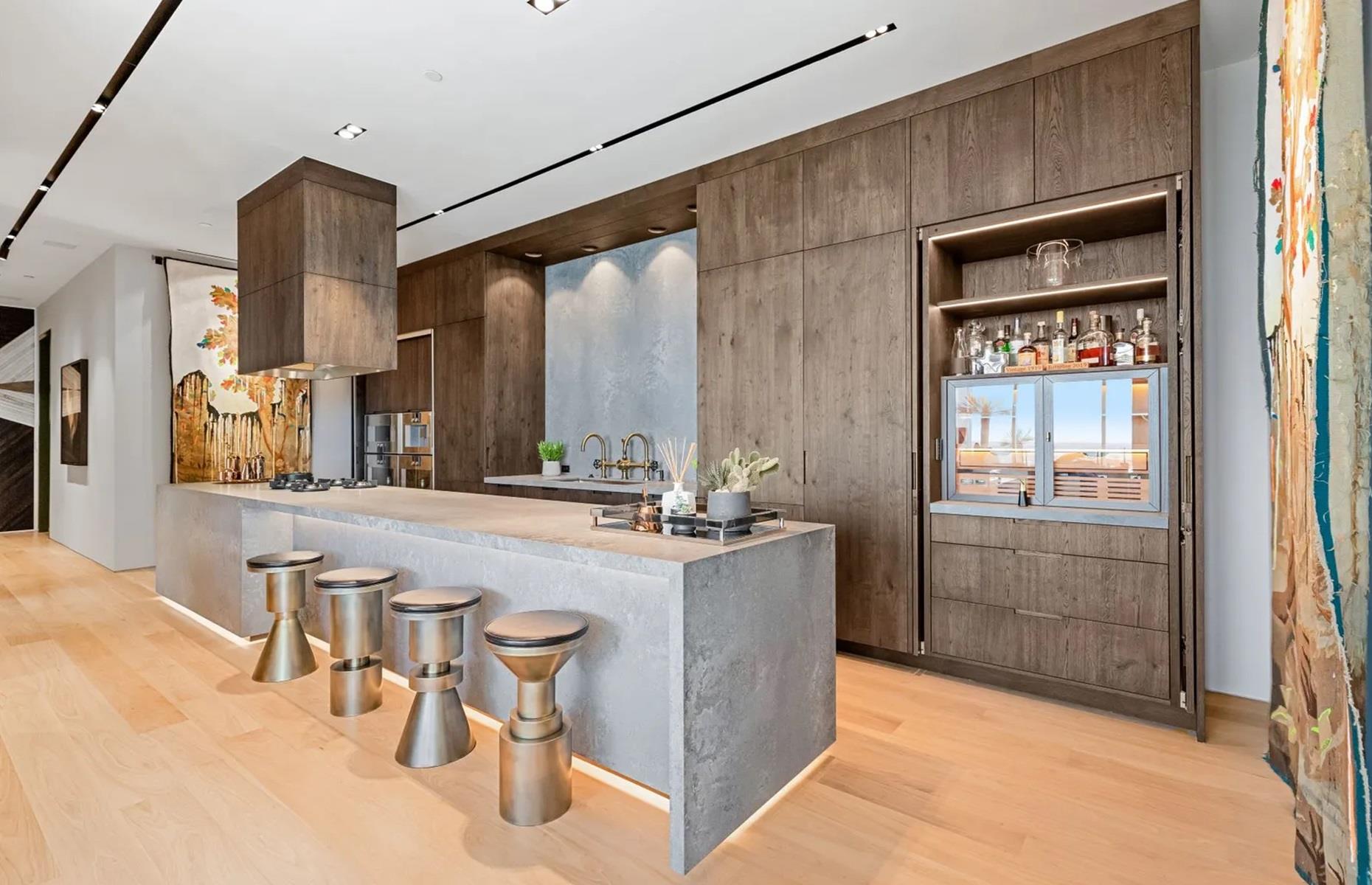 <p>As well as a huge living room, there’s also a formal dining room, a luxe kitchen with a floating center island, and ultra-pricey Gaggeneau appliances. There are also a few exterior terraces, where the lucky owner can take in dreamy views of Austin, including the skyline and Lady Bird Lake.  </p>